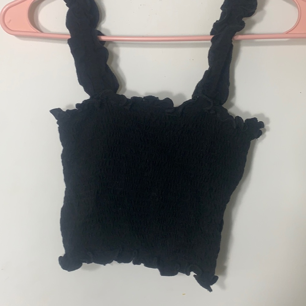 this is a black ruffled crop top.